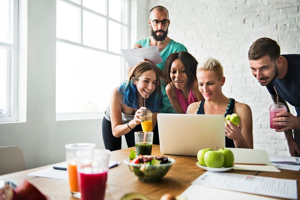 A group of healthy people is using laptop