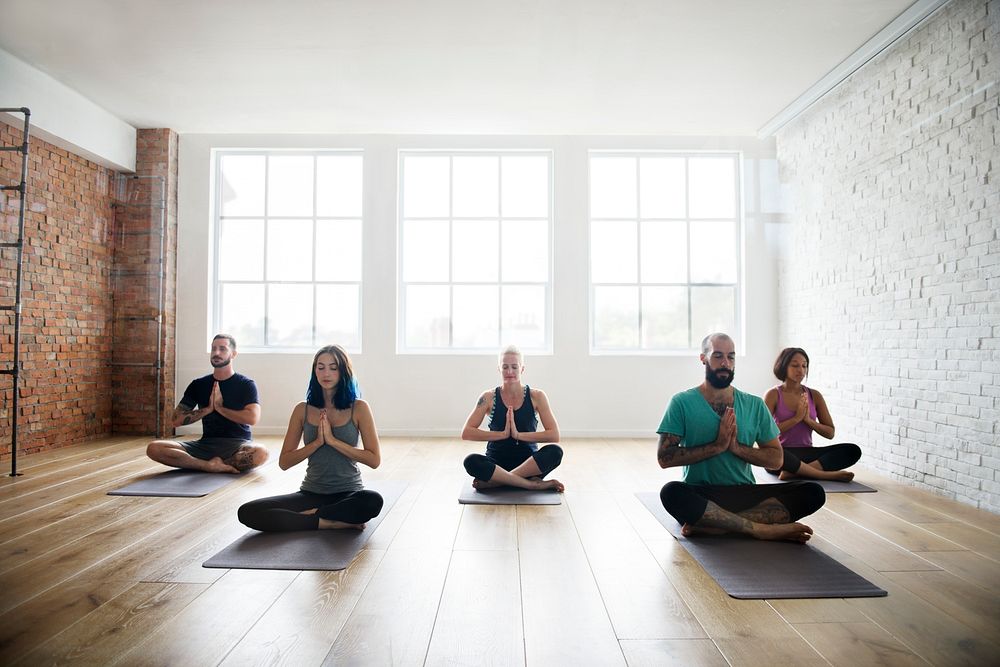 Group of diverse people are joining a yoga class