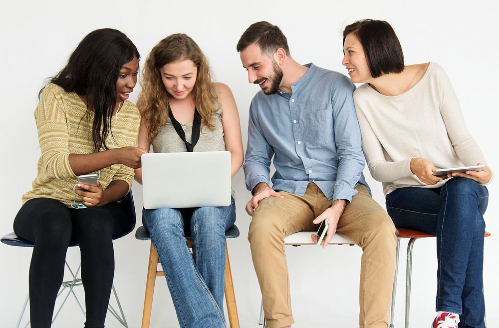 Diverse group of people using laptop