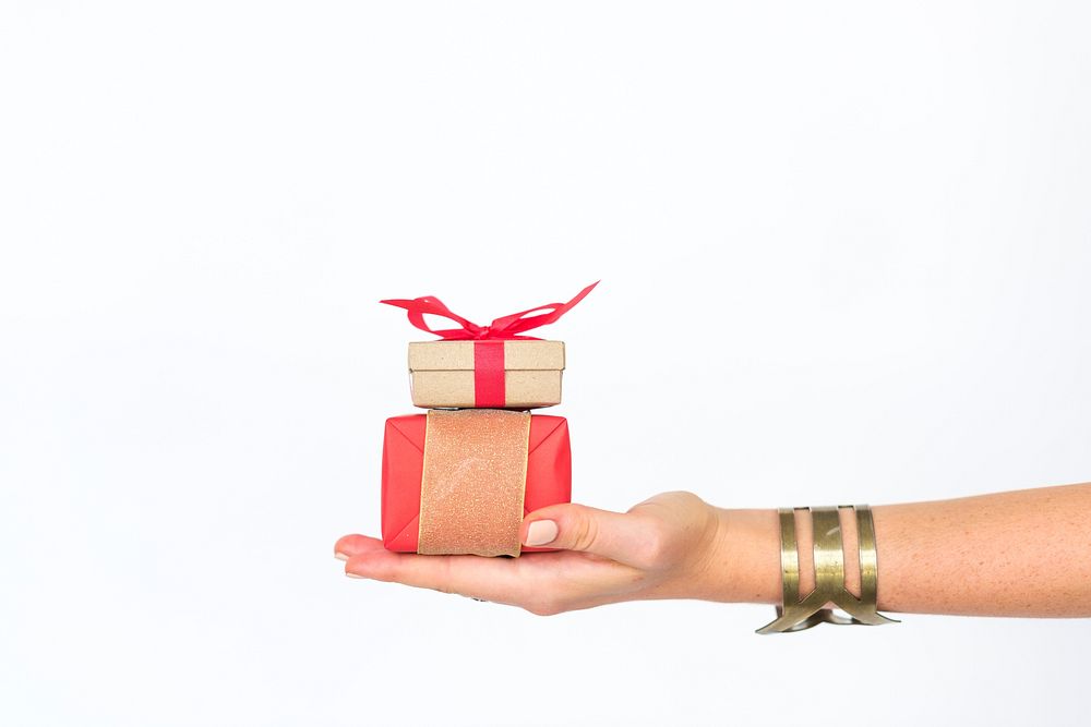 Hand holding a wrapped present