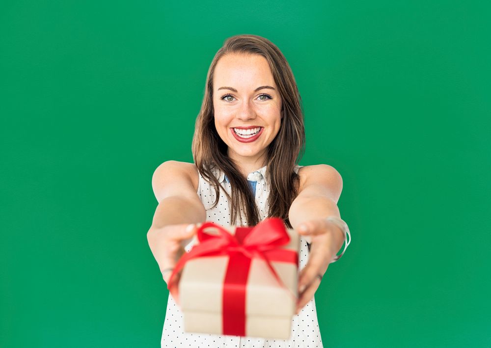 Girl handing out a wrapped present