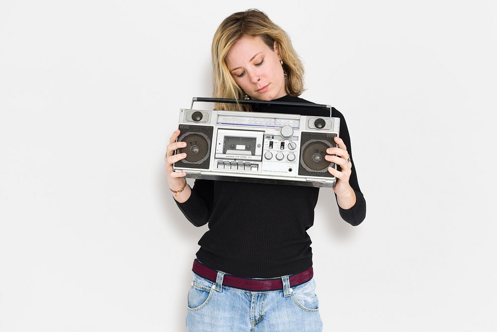 Blonde lady holding a radio