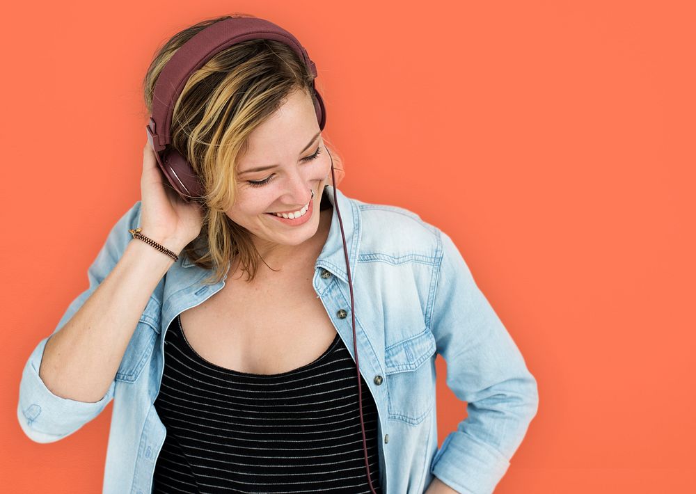 Female Smiling Listen Music Headphones Concept
