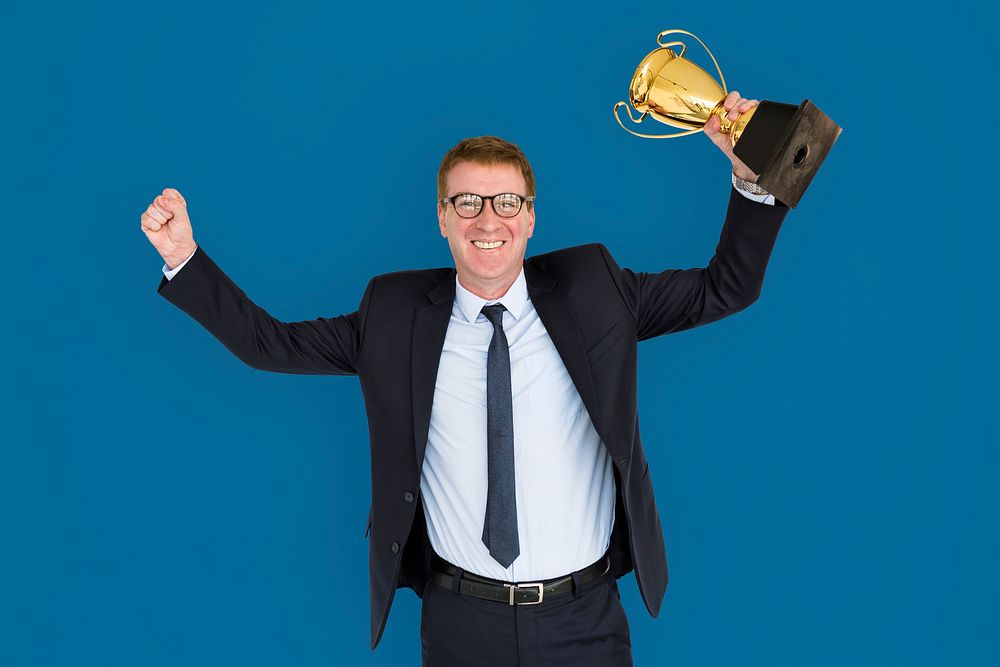 Business Man Holding Trophy Happy