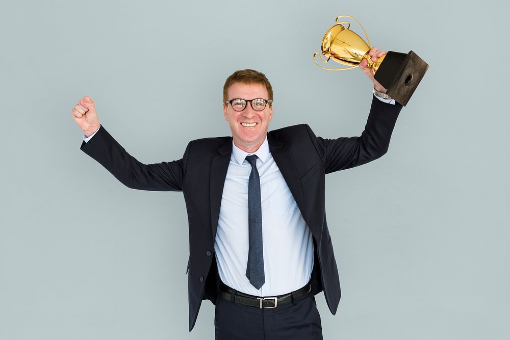 Business Man Holding Trophy Happy