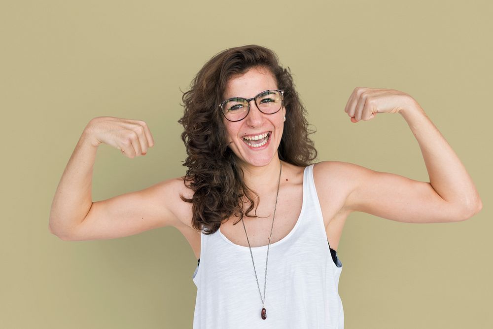 Brunette woman showing her arm muscles