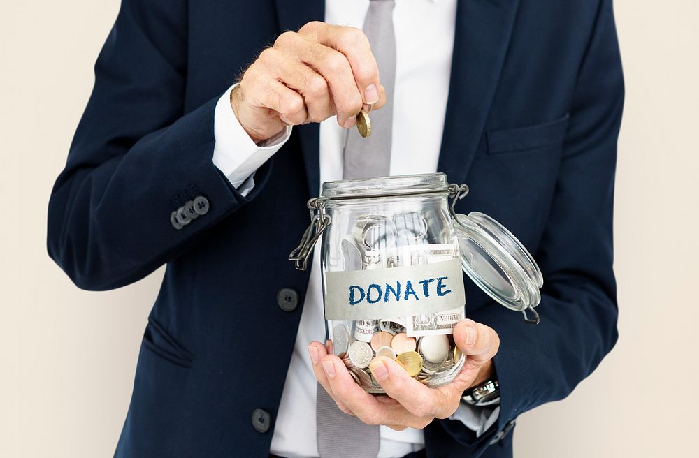 Businessman GIving Money Donation Charity Concept