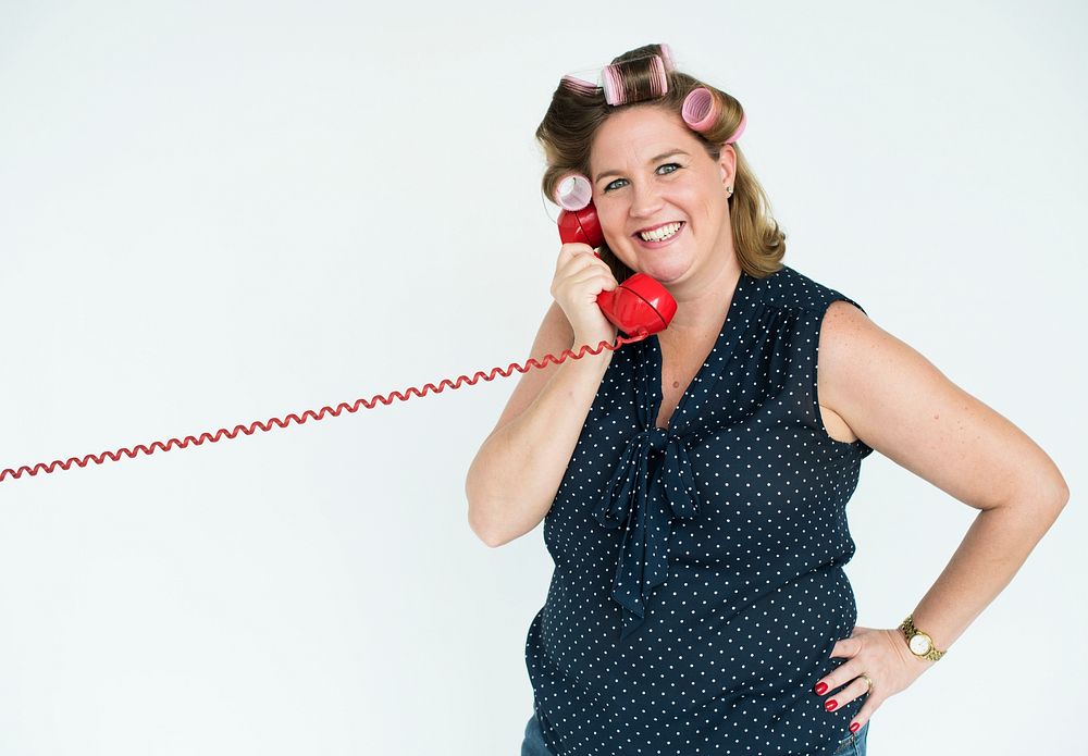 Housewife with retro red phone
