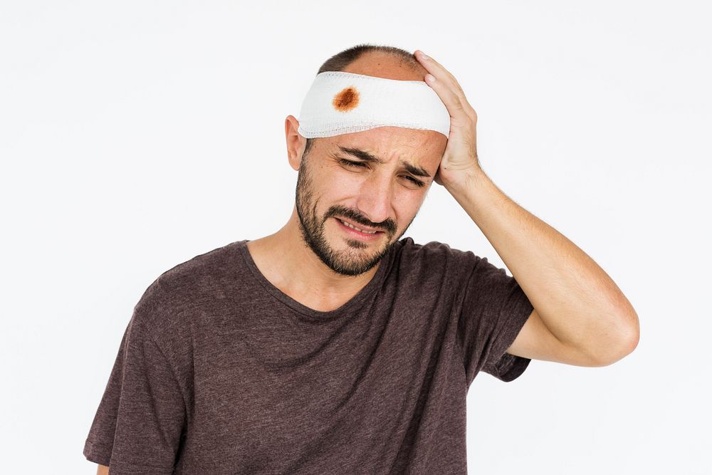 Man with bandage around his head