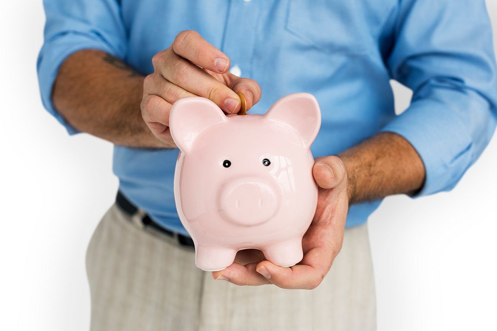 Man Holding Piggy Bank Saving Portrait Concept