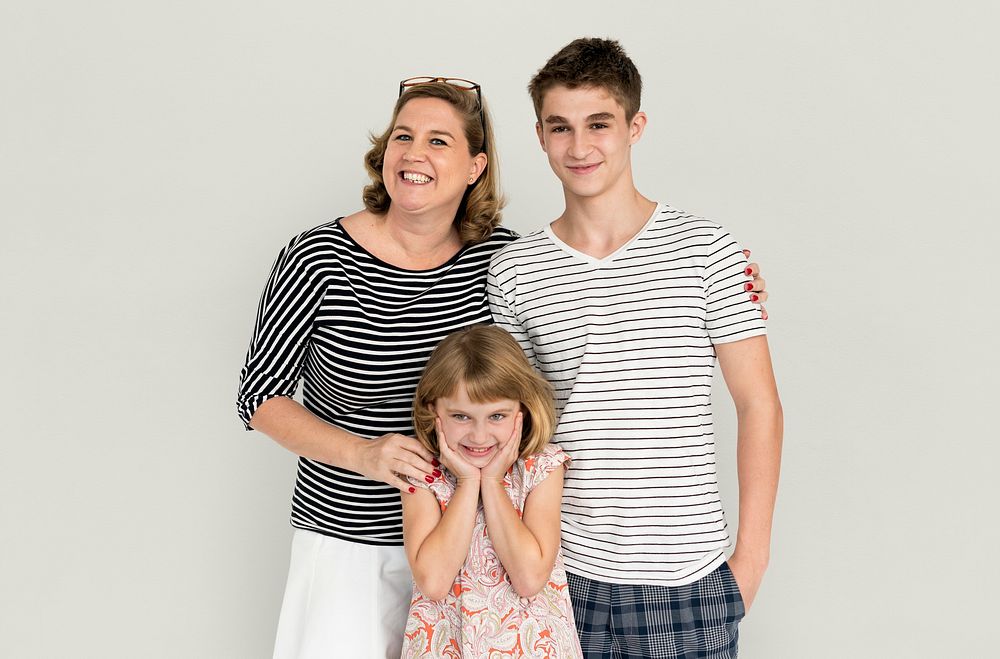 Mother, son and daughter studio family portrait