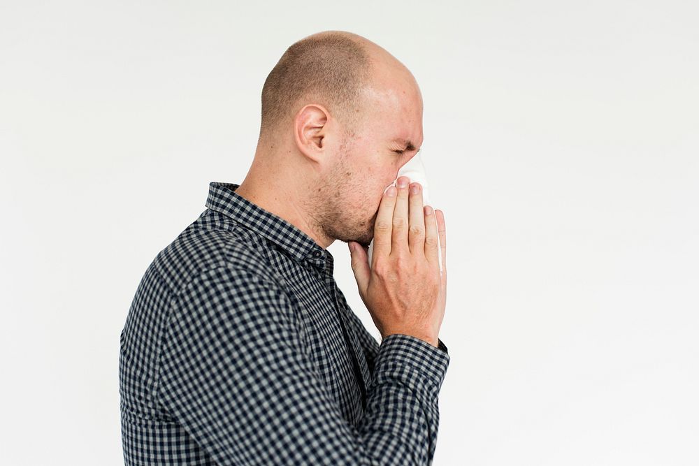 Man Sneezing Studio Portrait Concept