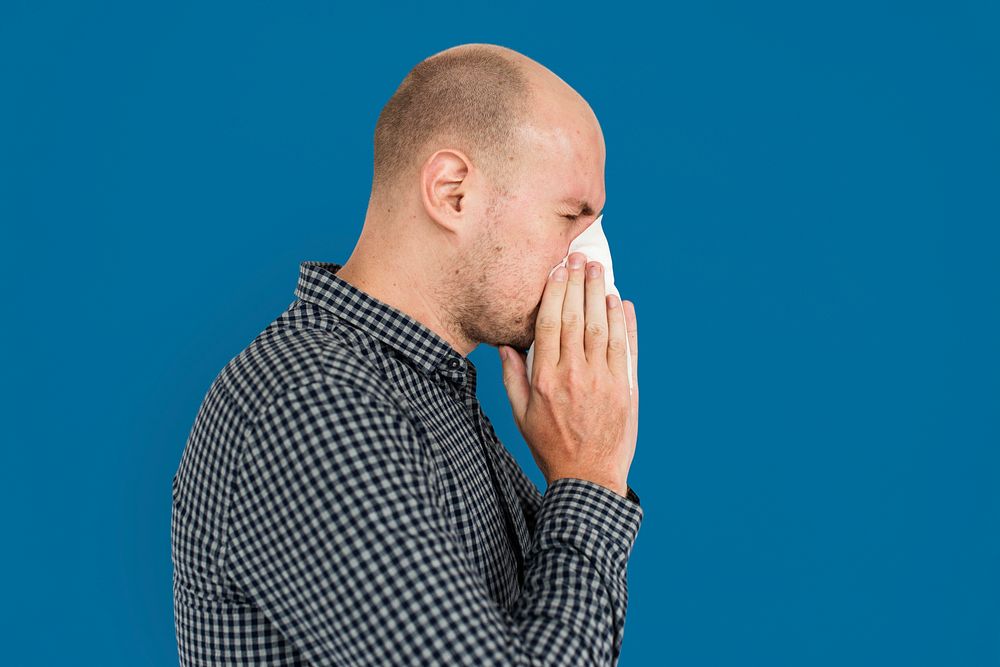 Man Sneezing Studio Portrait Concept