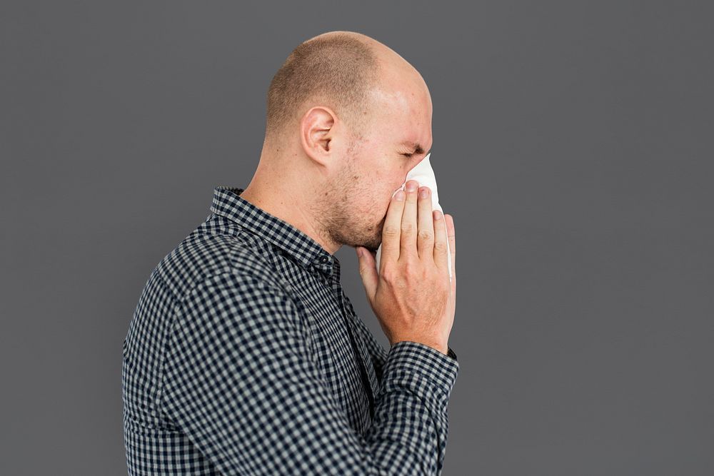 Man Sneezing Studio Portrait Concept