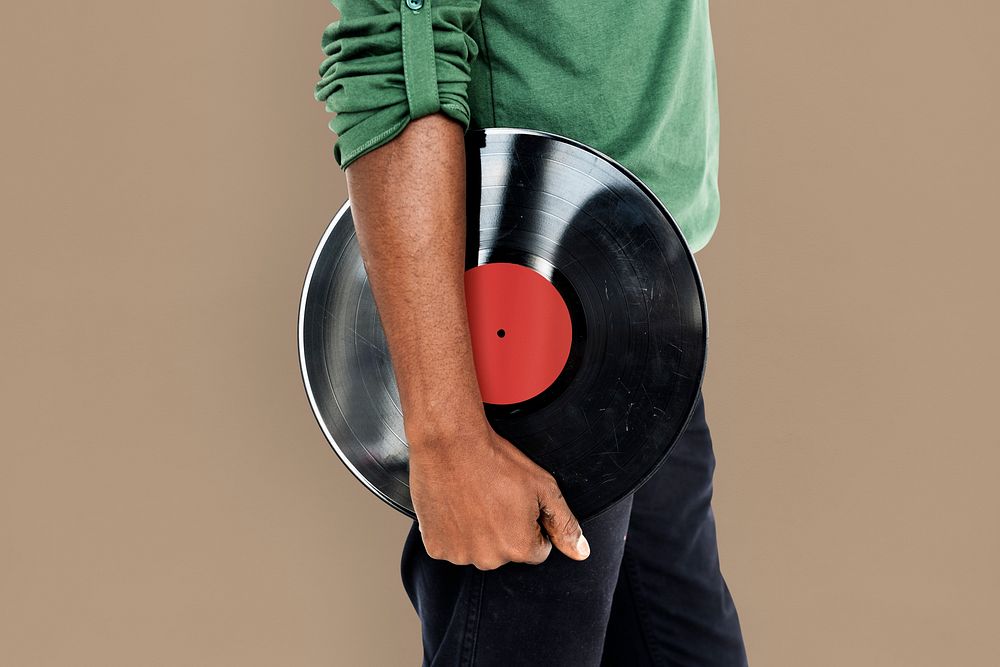 African Man Holding Vinyl Disc Jockey Music Concept