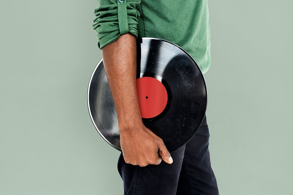 African Man Holding Vinyl Disc Jockey Music Concept