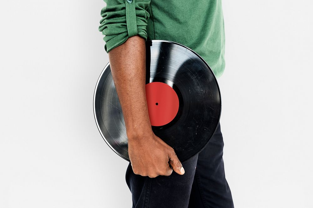 Man holding a vintage vinyl record