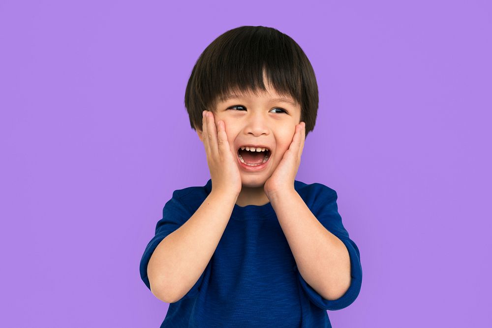 Young boy looking shocked or scared