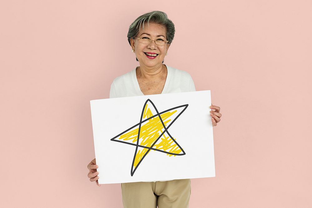 Woman holding placard with star icon