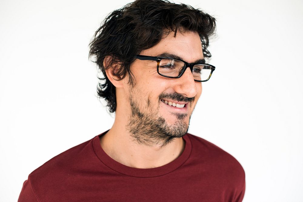 Studio portrait of a guy with dimples wearing glasses