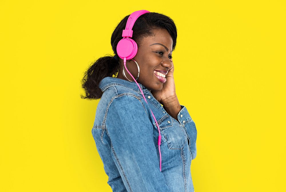 Portrait of an African woman with pink headphones