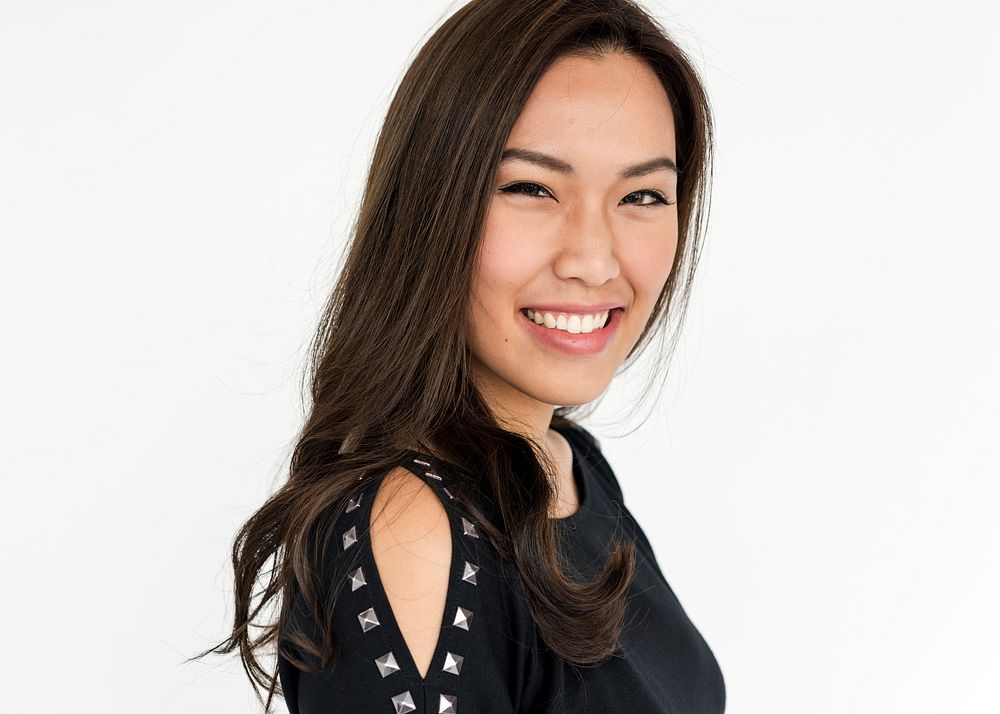 Studio portrait of an asian woman smiling
