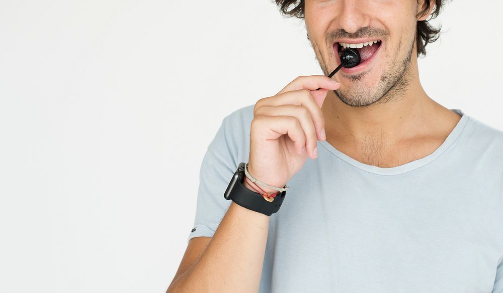 Man Eating Lollipop Candy Sweet Portrait Concept