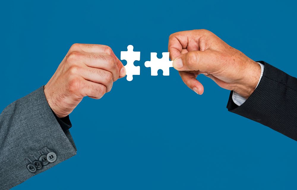 Human Hand Holding Jigsaw Puzzle Connection Corporate Business
