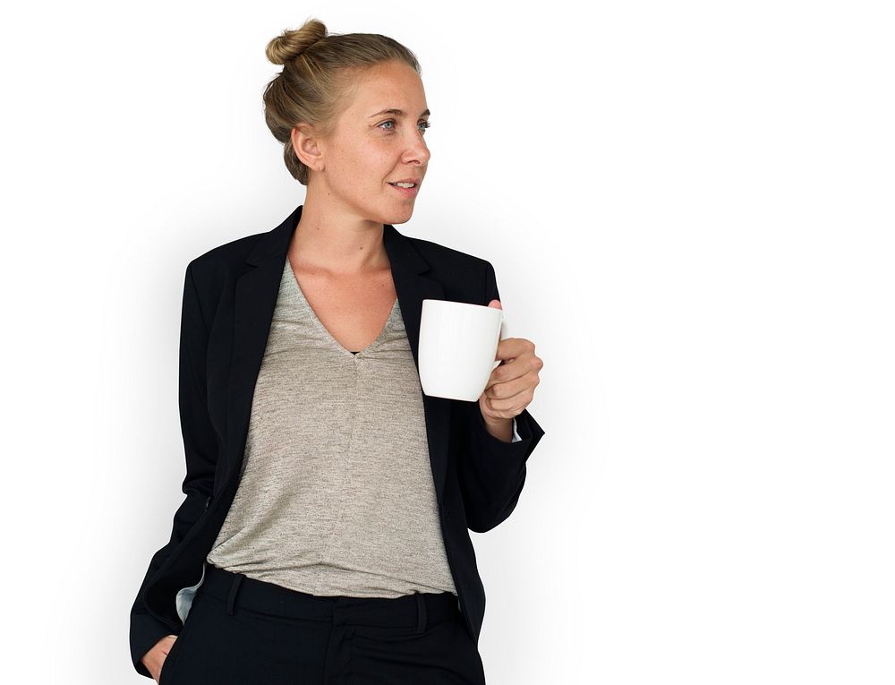 Woman in corporate attire drinking coffee