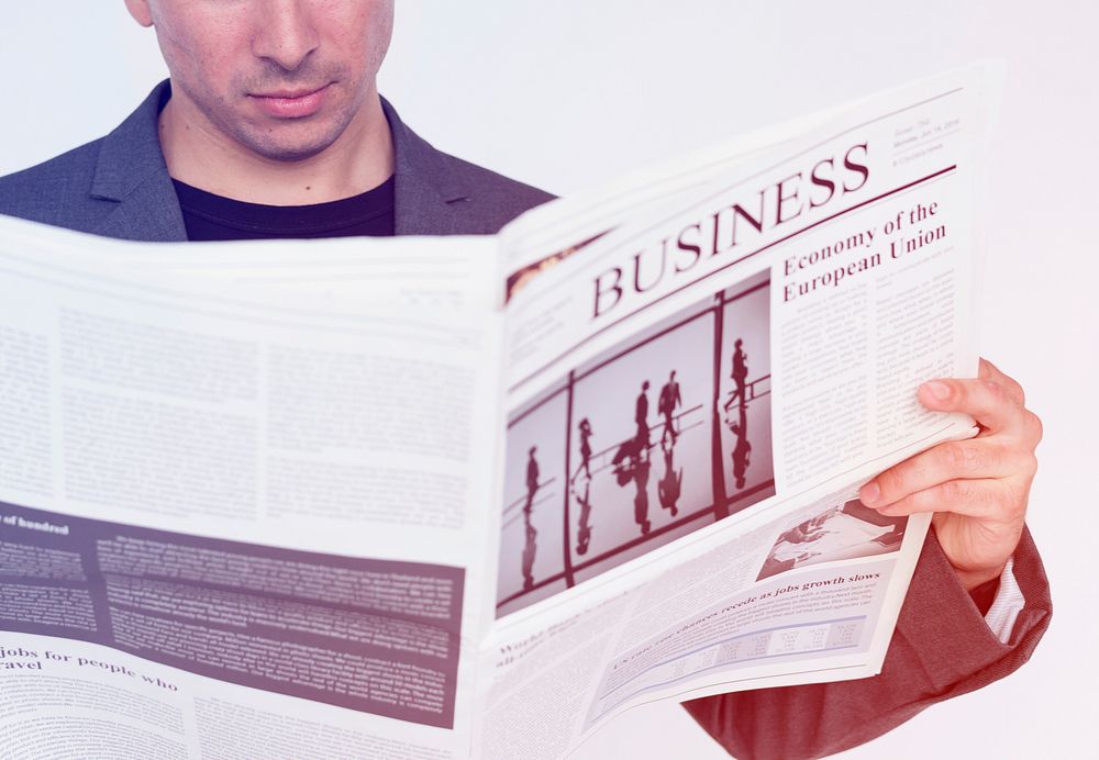 Man Reading Update Business Newspaper Studio