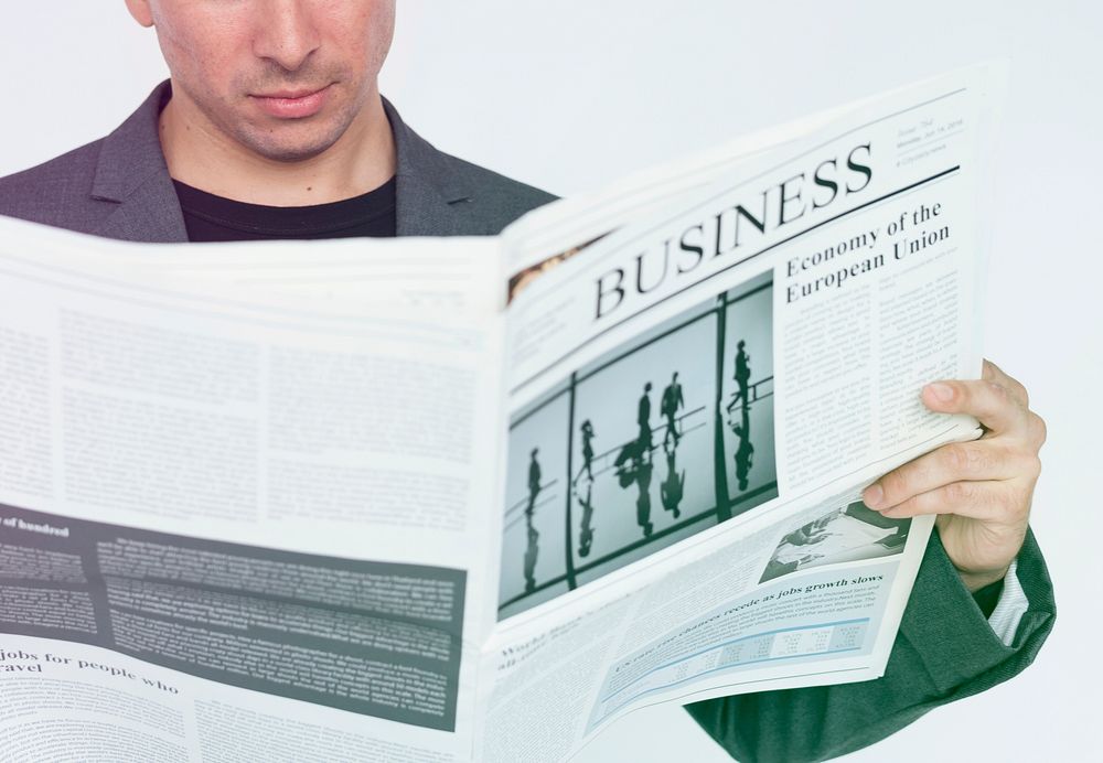 Man Reading Update Business Newspaper Studio
