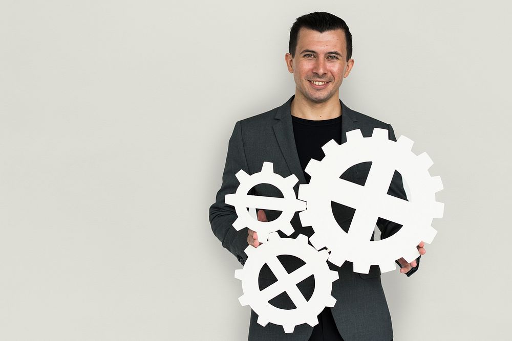 Businessman Smiling Happiness Holding Gear Symbol Concept