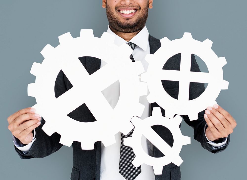 Businessman Smiling Happiness Holding Gear Symbol Concept