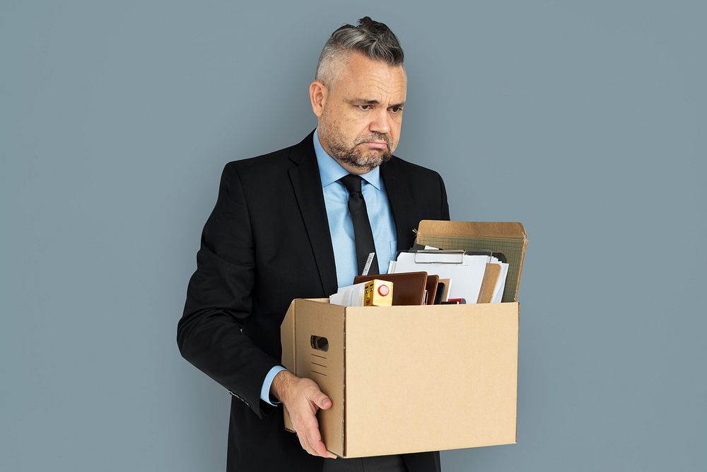 Caucasian Man Holding Box Sad
