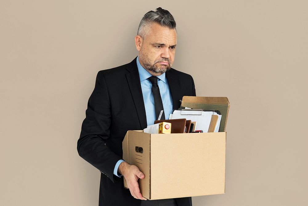 Caucasian Man Holding Box Sad