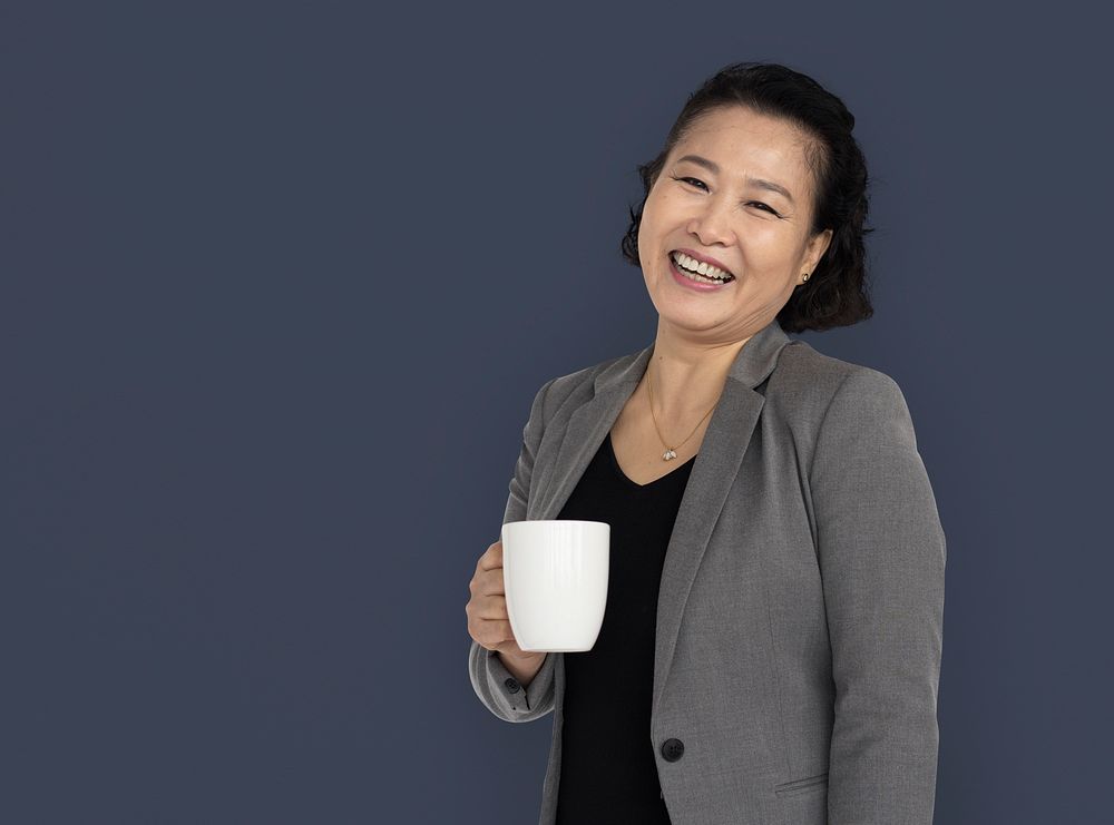 Asian Business Woman Holding Coffee Smiling