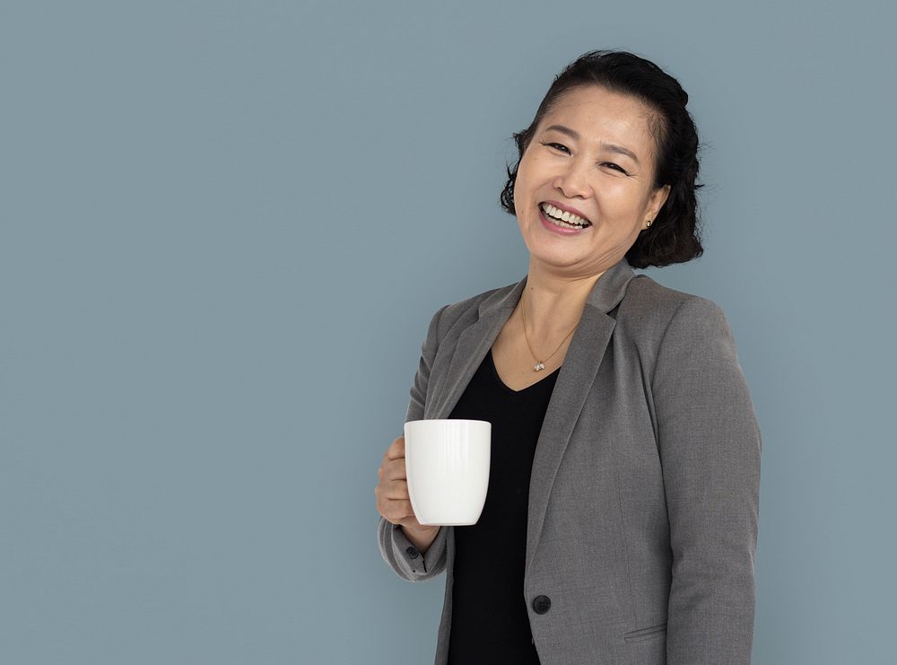 Asian Business Woman Holding Coffee Smiling
