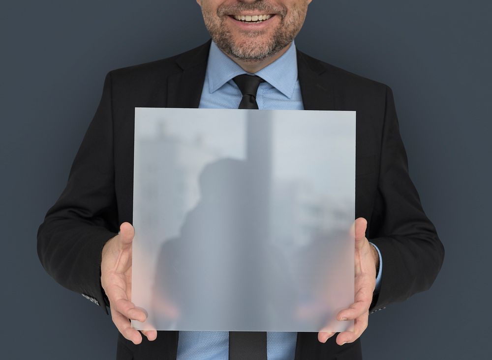 Business Man Holding Panel Smiling