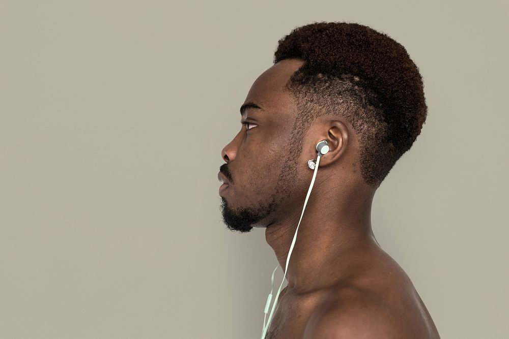 Studio profile of a man wearing earphones