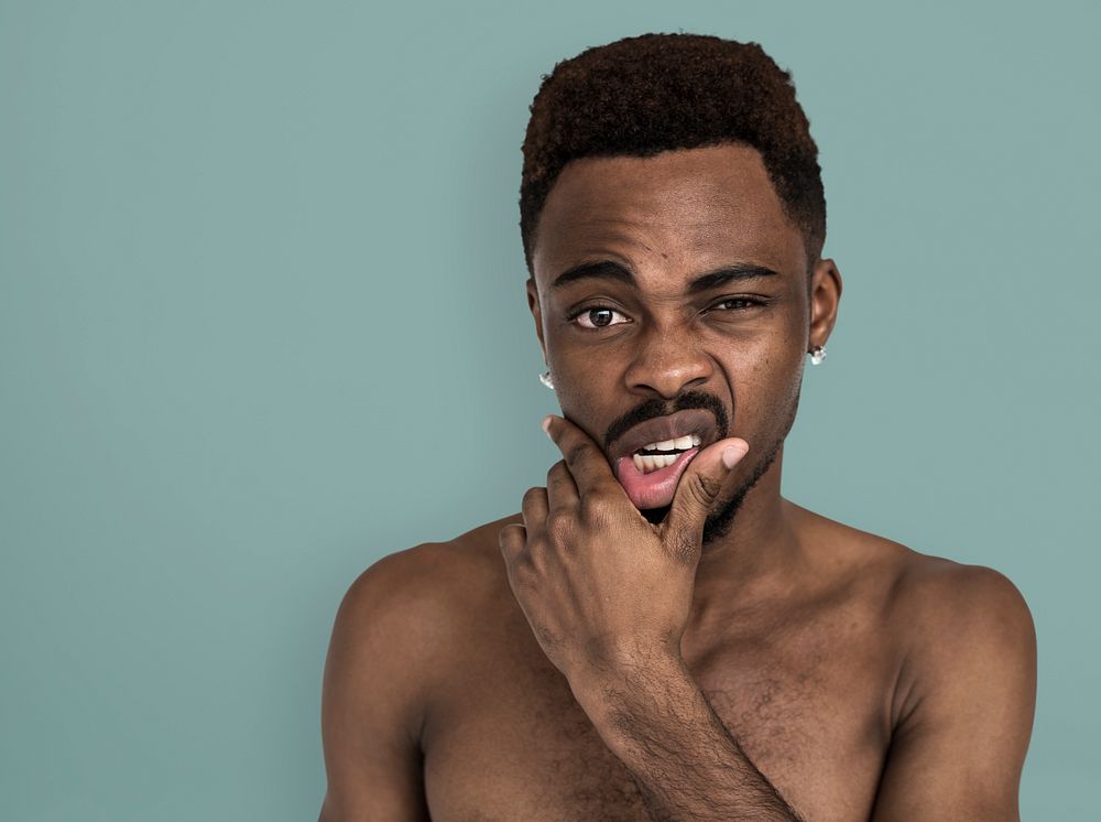 African Man Bare Chest Touching Mouth Portrait