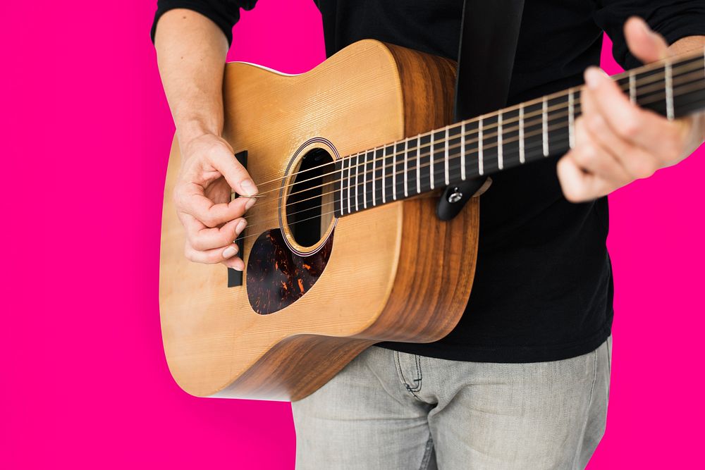 Caucasian Man Playing Guitar Closeup