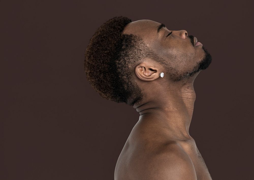African Man Bare Chest Chin Up Side View Portrait