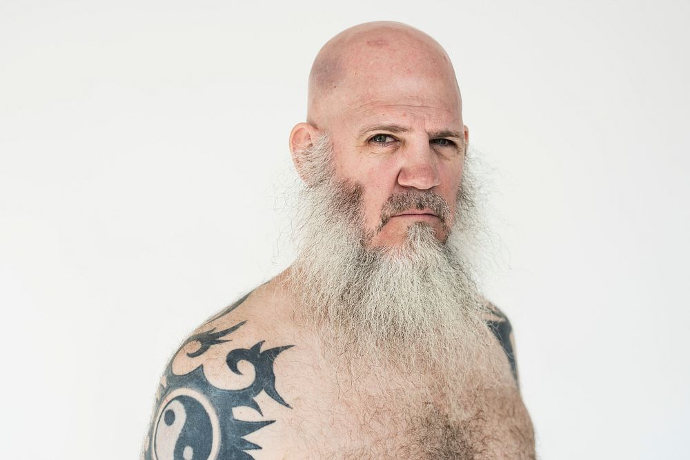 Portrait of a big tattooed bearded man