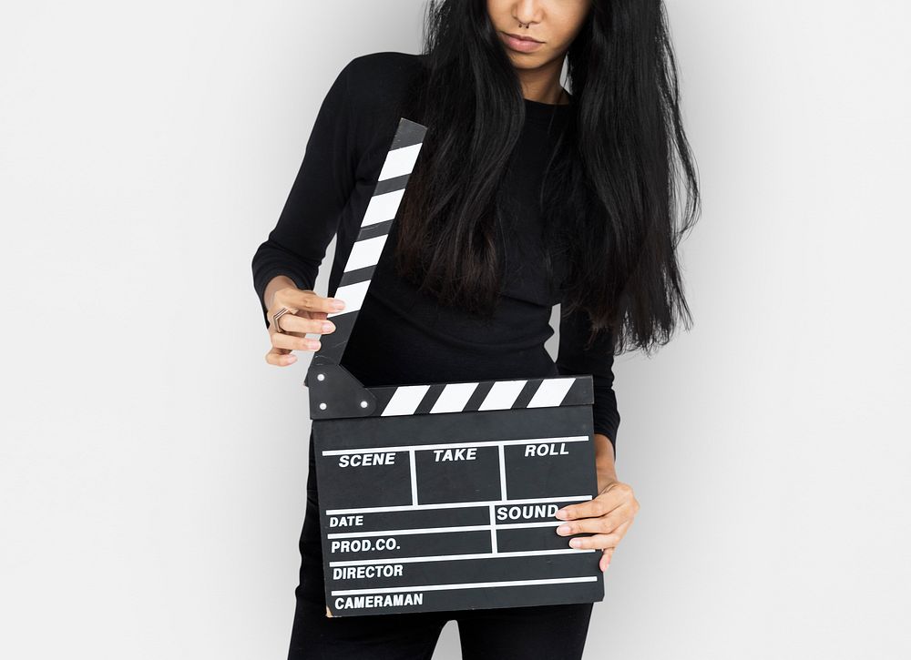 Young Women Hands Hold Clapper Board