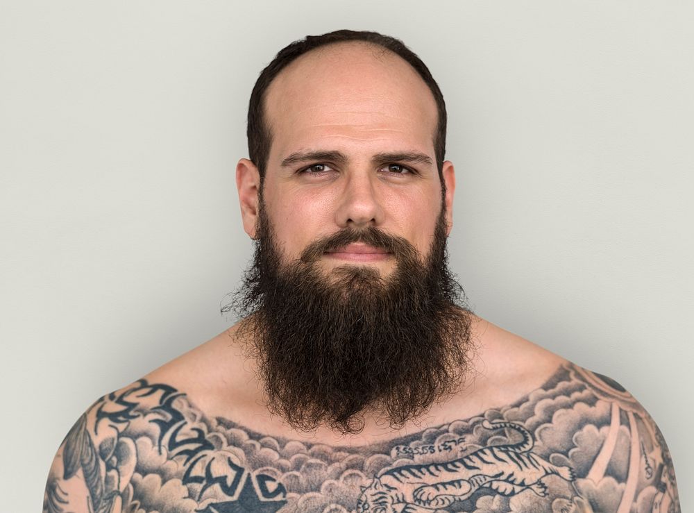 Caucasian Man Bare Chested Tattoo Beard