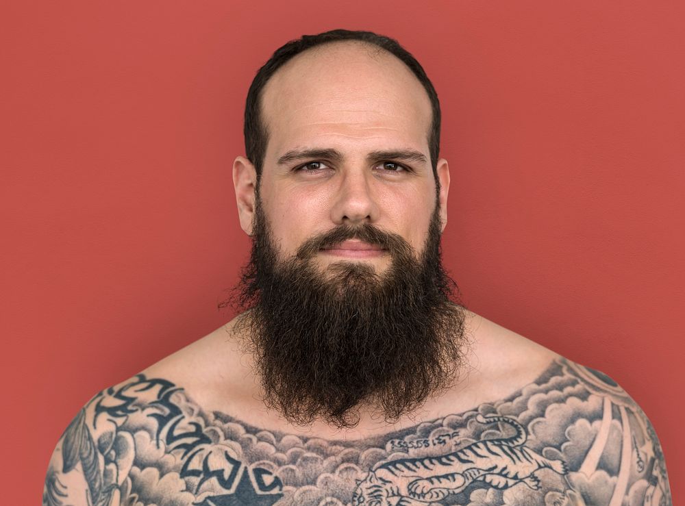Caucasian Man Bare Chested Tattoo Beard
