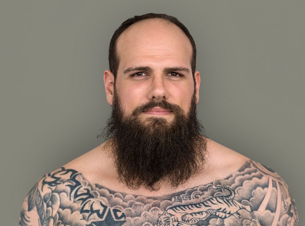 Caucasian Man Bare Chested Tattoo Beard