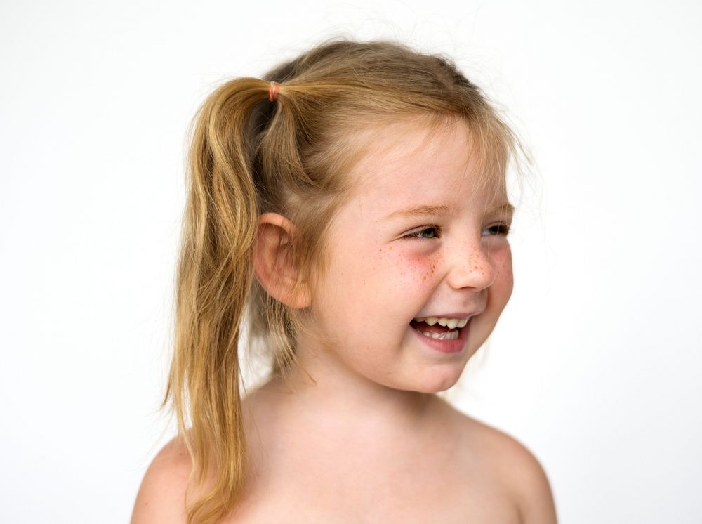 Young girl smiling face expression studio portrait