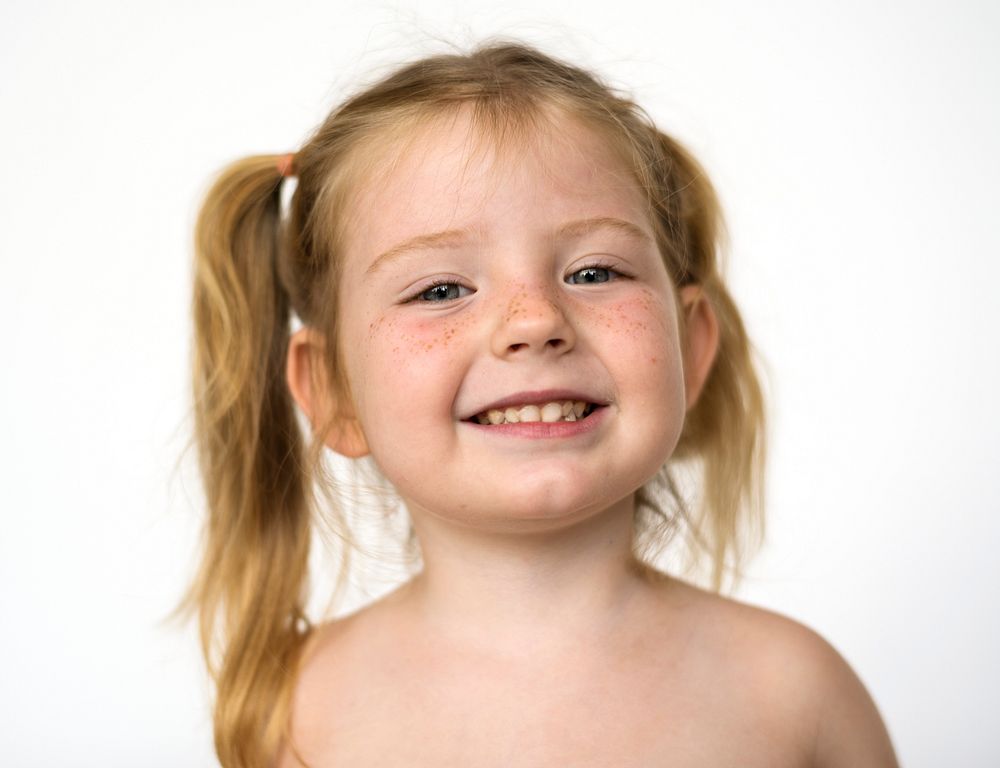 Portrait of a young girl with freckles