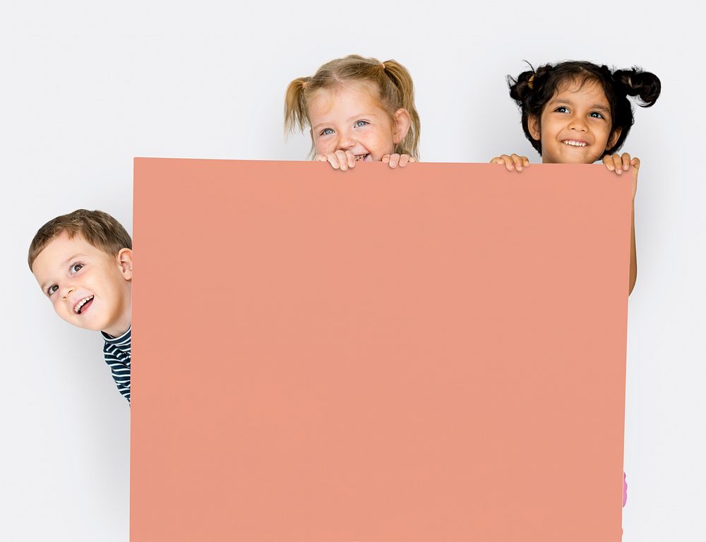 Little Children Holding Empty Paper Smiling